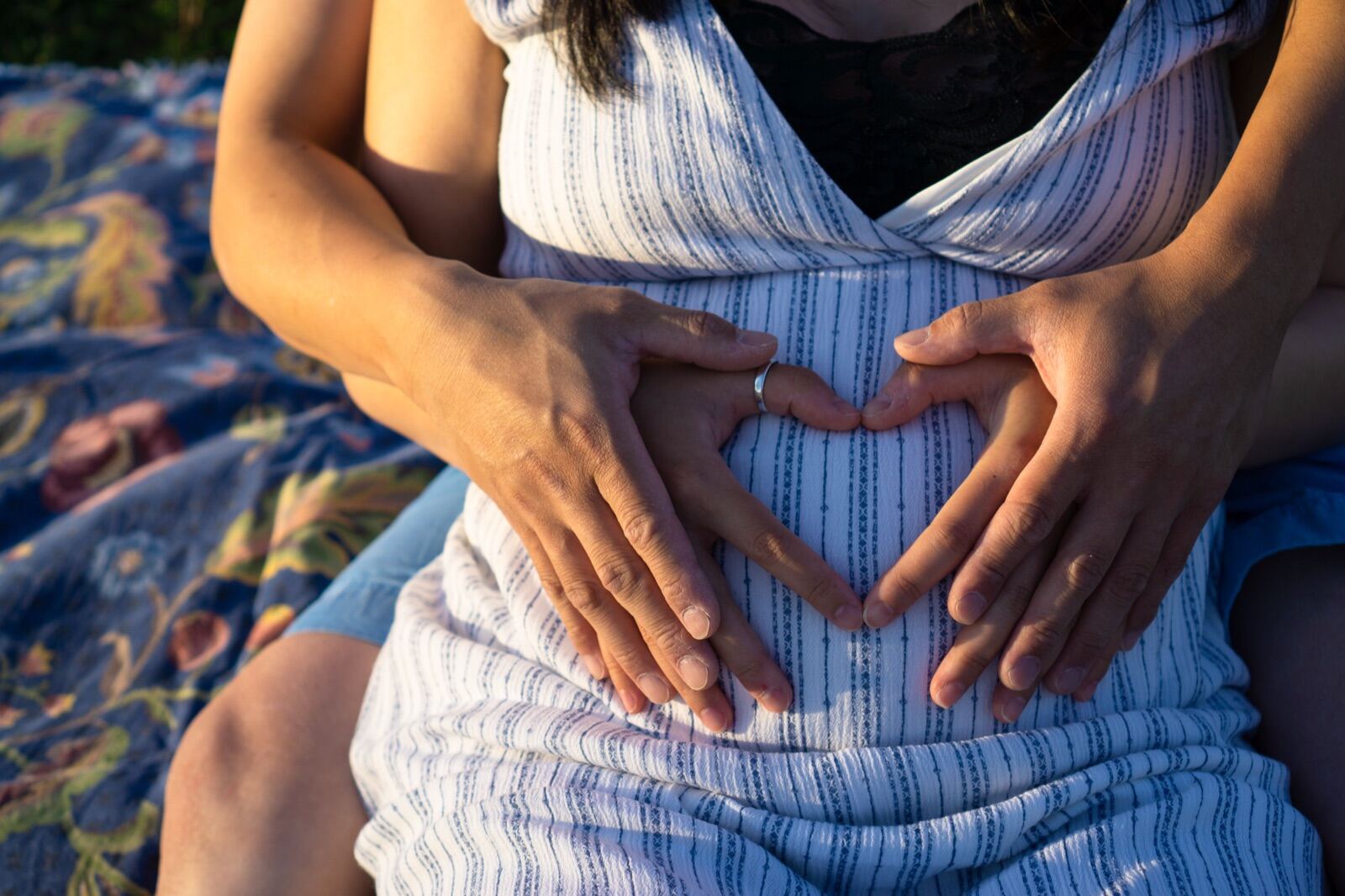 Maternity portrait, hands forming a heart
