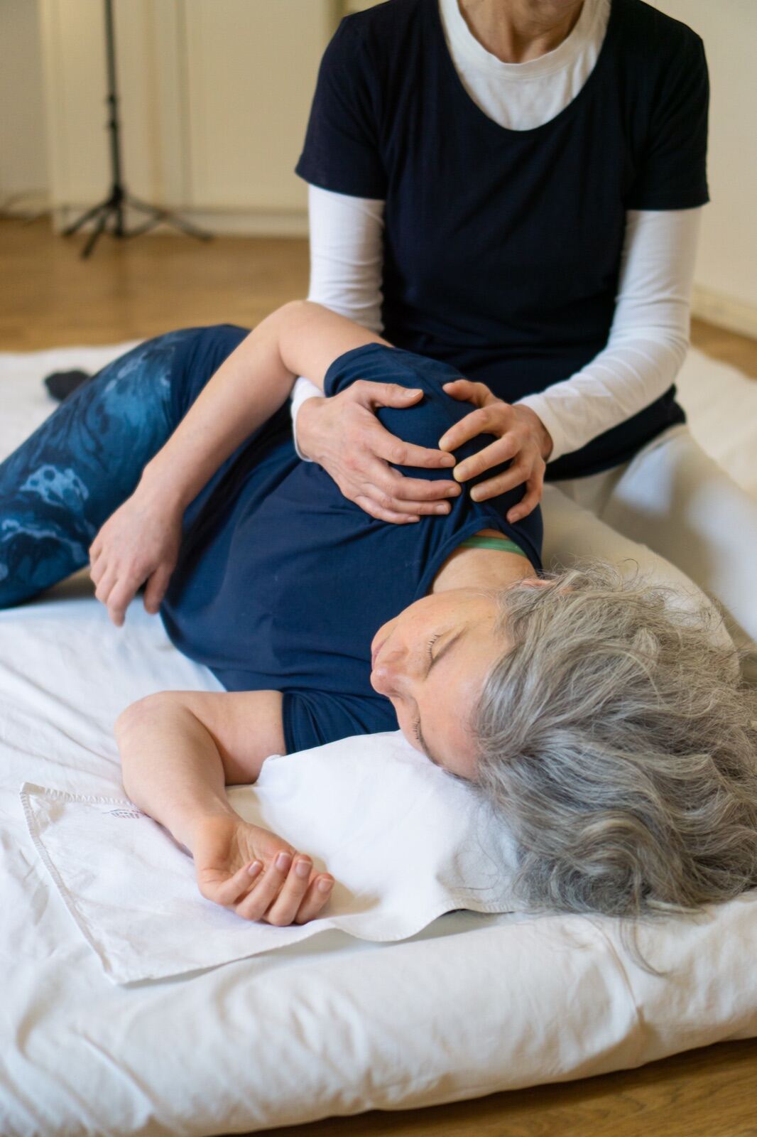 Shiatsu practitioner at work with a client