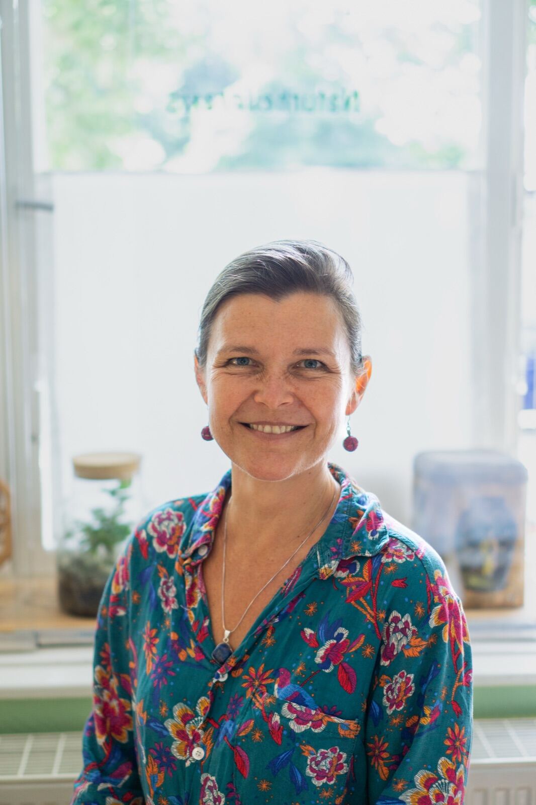 Practitioner portrait in a bright studio