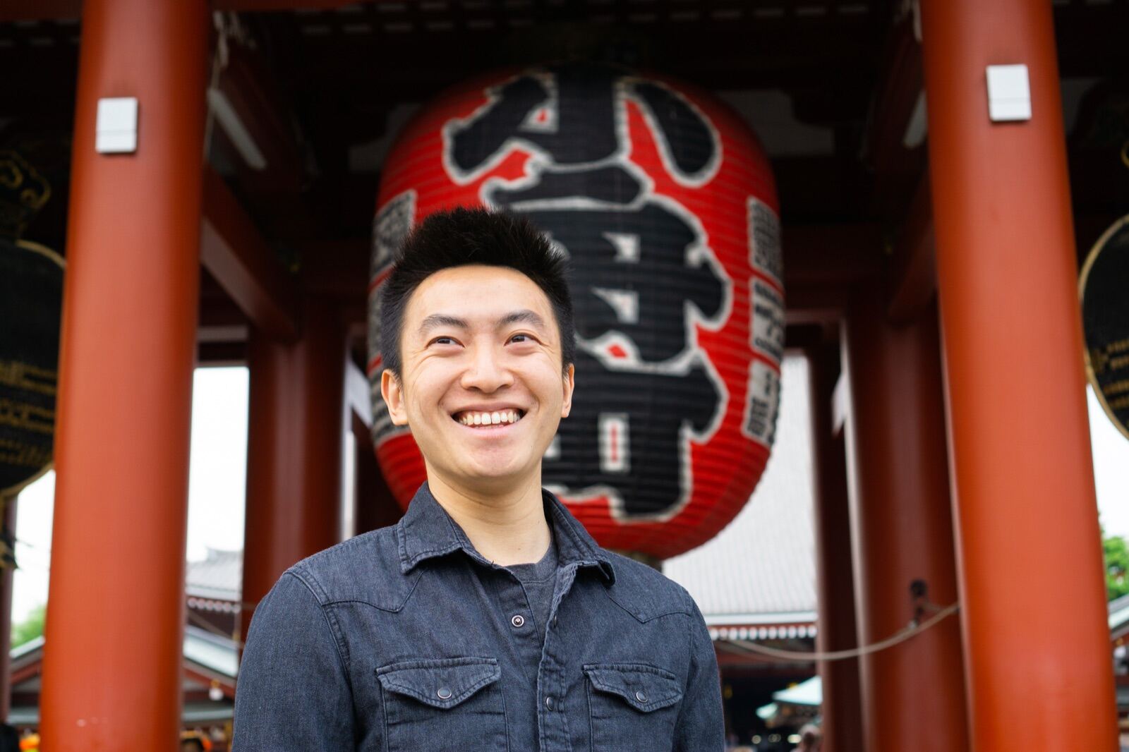 Portrait beneath a giant temple lantern in Tokyo