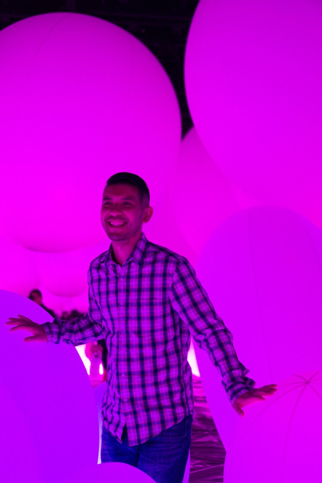 Portrait among glowing pink lights