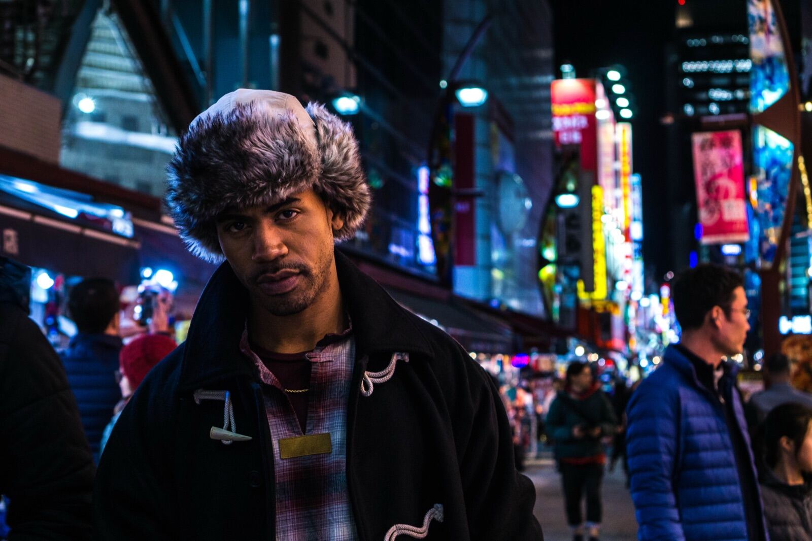 Night portrait in a neon-lit street